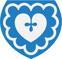 Kommunevåpenet, hentet fra et malt våpenskjold på korets nordvegg.