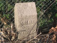 1878-grensestein nr. 23 mellom Aker og Kristiania ved Brannfjellveien 10. Foto: Stig Rune Pedersen (2013).