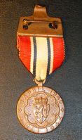 Deltagermedaljens forside. Medaljen ble tildelt nordmenn og allierte som deltok i militær kamp for Norge under andre verdenskrig.