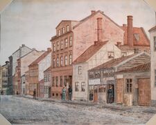 1891: Parti fra Nedre Vollgate, Stortinget i bakgrunnen i venstre bildekant.