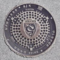 Kumlokk med kommunevåpenet produsert av Ulefos Jernværk. Foto: Roy Olsen