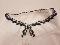 Skjorteliner sauma av Ragnhild Gjelstad.