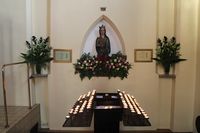 Mariastatuen med lysbord